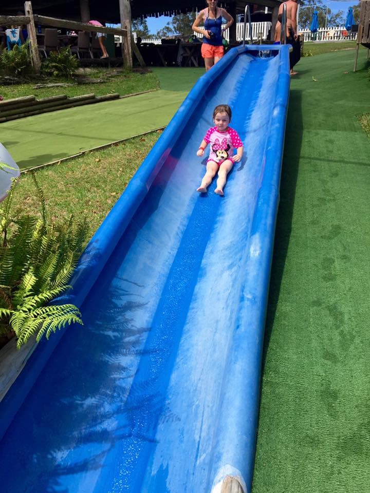 Kid Sliding with Adult's Supervision In The Big Buzz Fun Park in Rainbow Flat, NSW