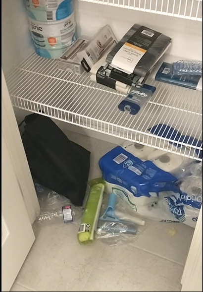A closet filled with toilet paper wipes and other items