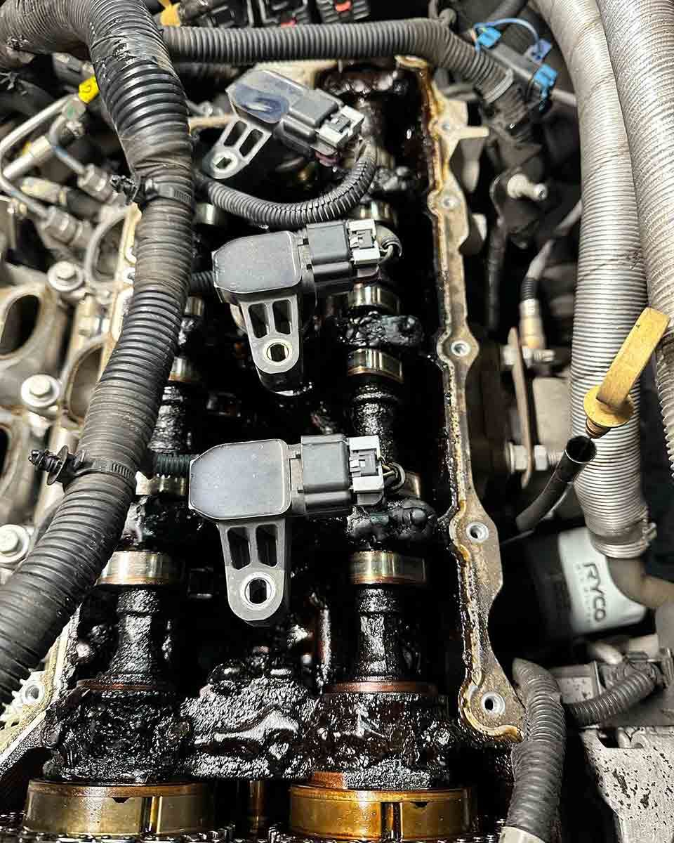 A Close Up Of A Car Engine With A Lot Of Oil On It — AZNU Automotive In Lismore, NSW