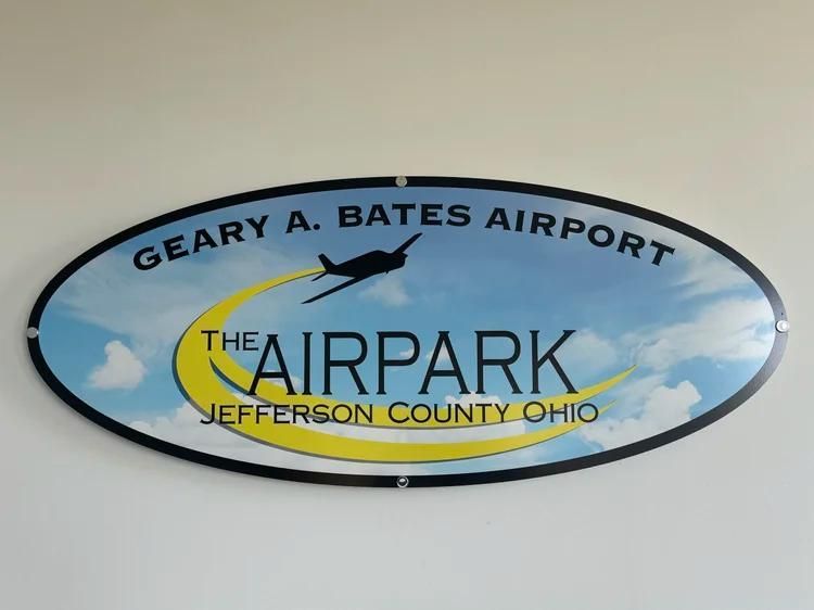 Oval Geary A. Bates Airport sign