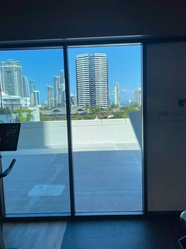 A Window Showing a Bright Cityscape