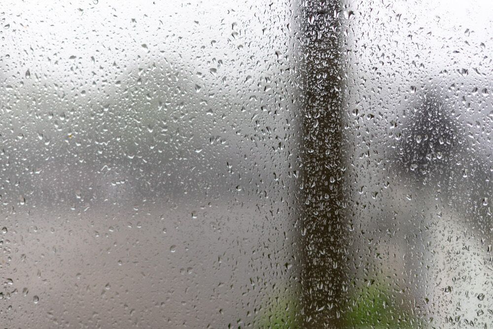 A window with condensation due to humidity