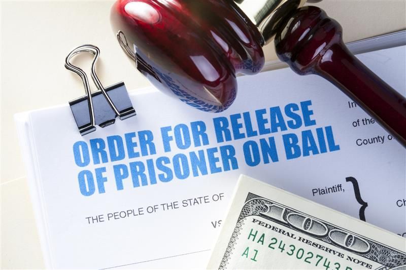 Paperwork for prisoner release through a bail bond agreement.