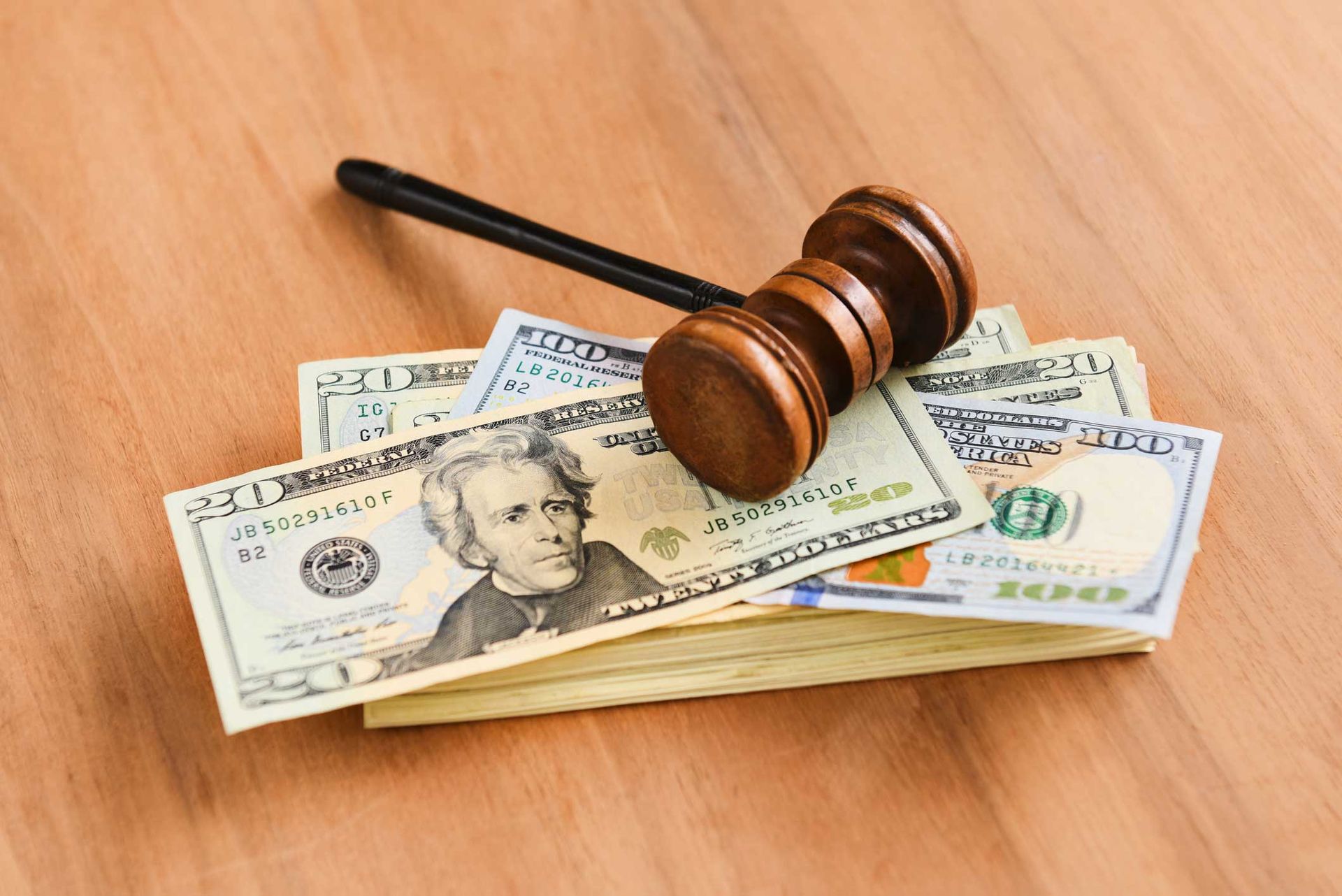 A brown judge’s gavel & cash stacks symbolizing misdemeanor bonds, justice, and bail services. A brown judge’s gavel & cash stacks symbolizing misdemeanor bonds, justice, and bail services.