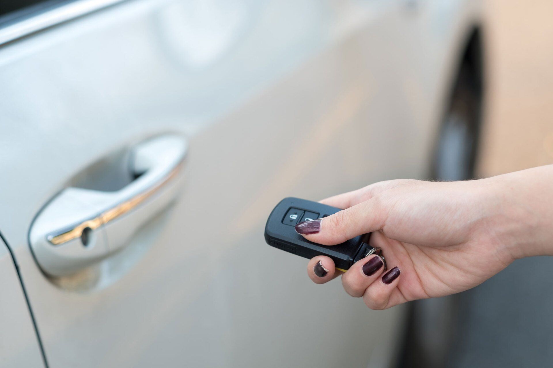 Pressing Button To Unlock A Car | Wooster, OH | The Locksmith Shop Inc.
