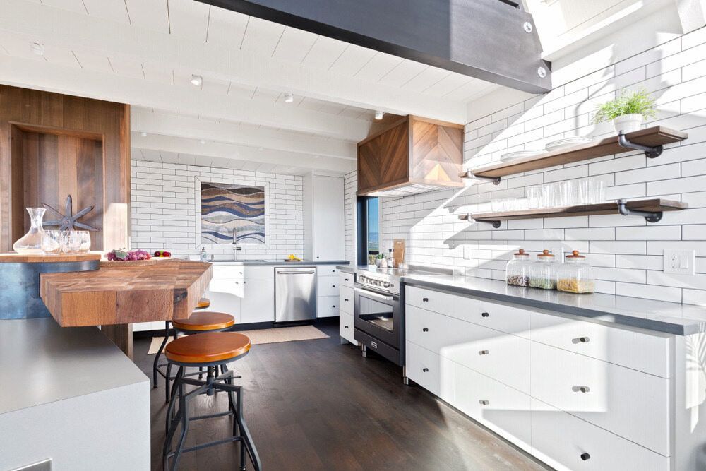 A Kitchen With White Cabinets Stainless Steel Appliances — Canberra Bathroom Solutions in Ngunnawal, ACT