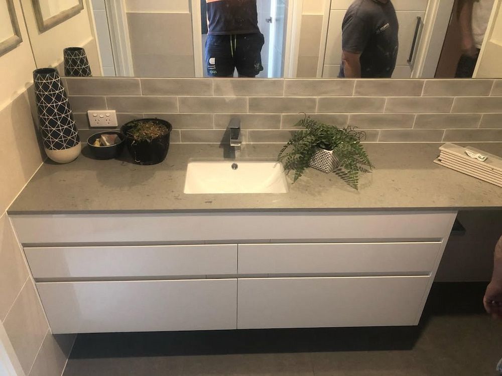 A Bathroom With a Sink and a Mirror — Canberra Bathroom Solutions in Woden, ACT