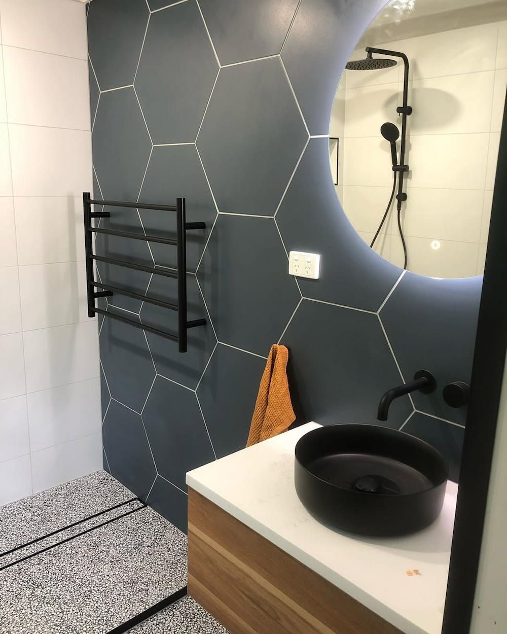 A Bathroom With a Sink Shower Mirror and Towel Rack — Canberra Bathroom Solutions in Tuggeranong, ACT
