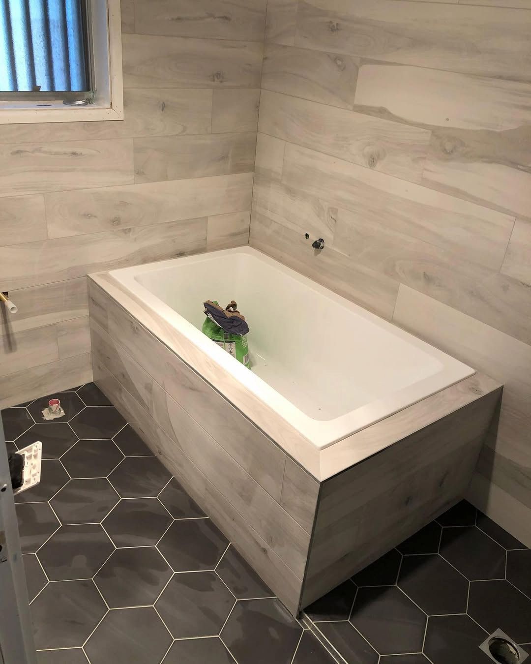 A Bathtub in a Bathroom With a Frog in It — Canberra Bathroom Solutions in Woden, ACT