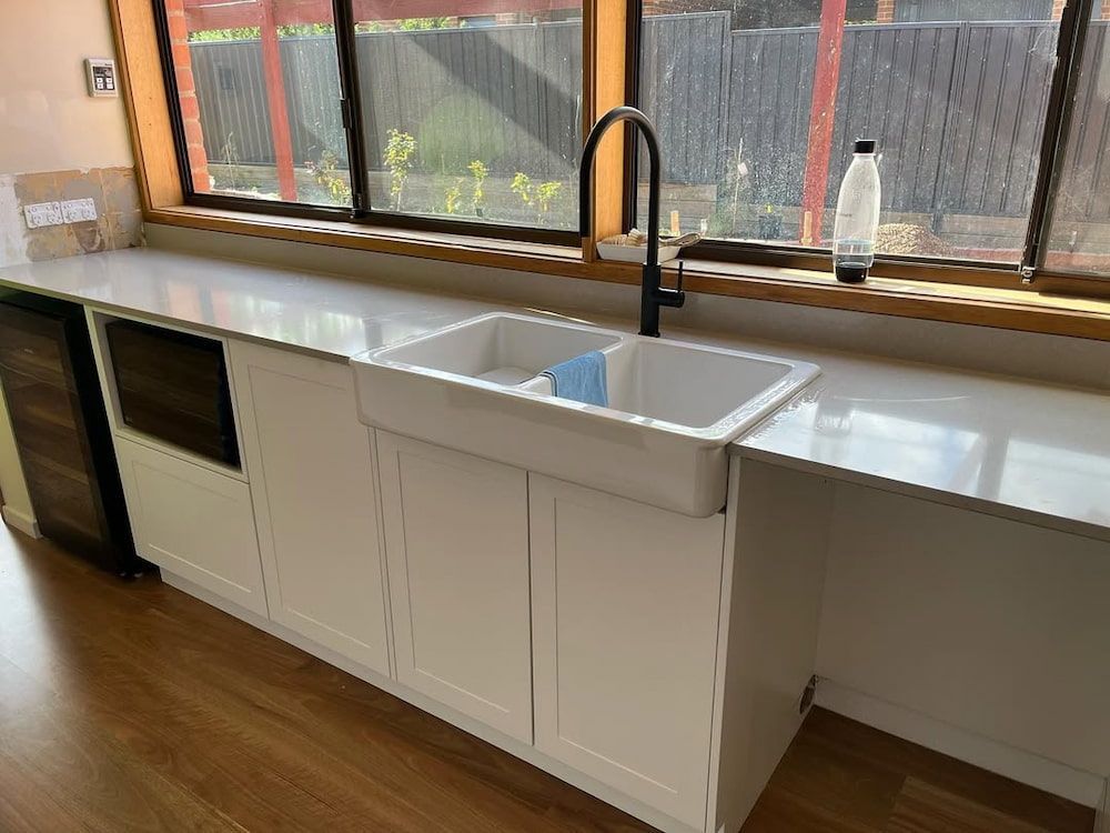 A Kitchen With a Sink and a Window — Canberra Bathroom Solutions in Ngunnawal, ACT