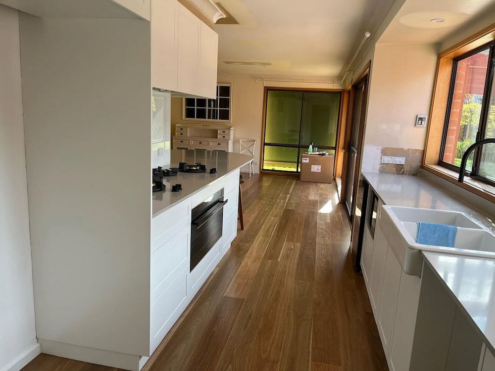 A Kitchen With a Sink and a Window — Canberra Bathroom Solutions in Ngunnawal, ACT