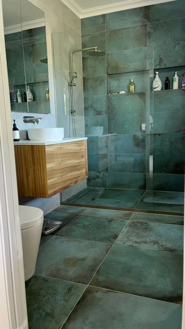 A Bathroom With a Walk in Shower Sink Toilet and Mirror — Canberra Bathroom Solutions in Ngunnawal, ACT
