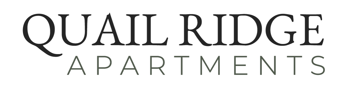 "Quail Ridge Apartments" logo in black text. "Quail Ridge" is above "Apartments."
