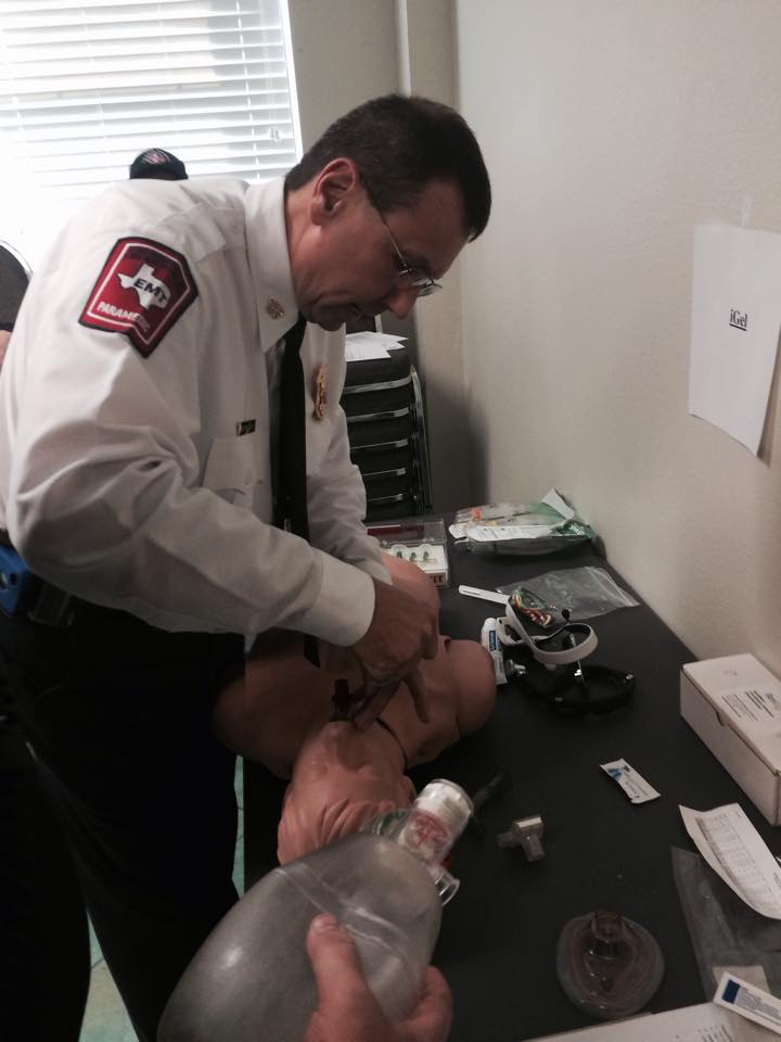 A picture of a fire officer in a white shirt.