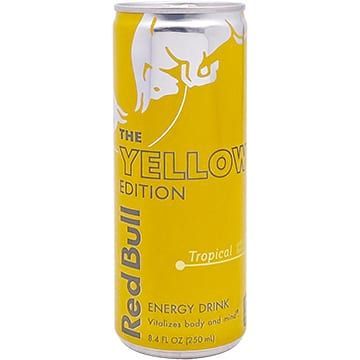 Yellow Red Bull energy drink can with tropical flavor.