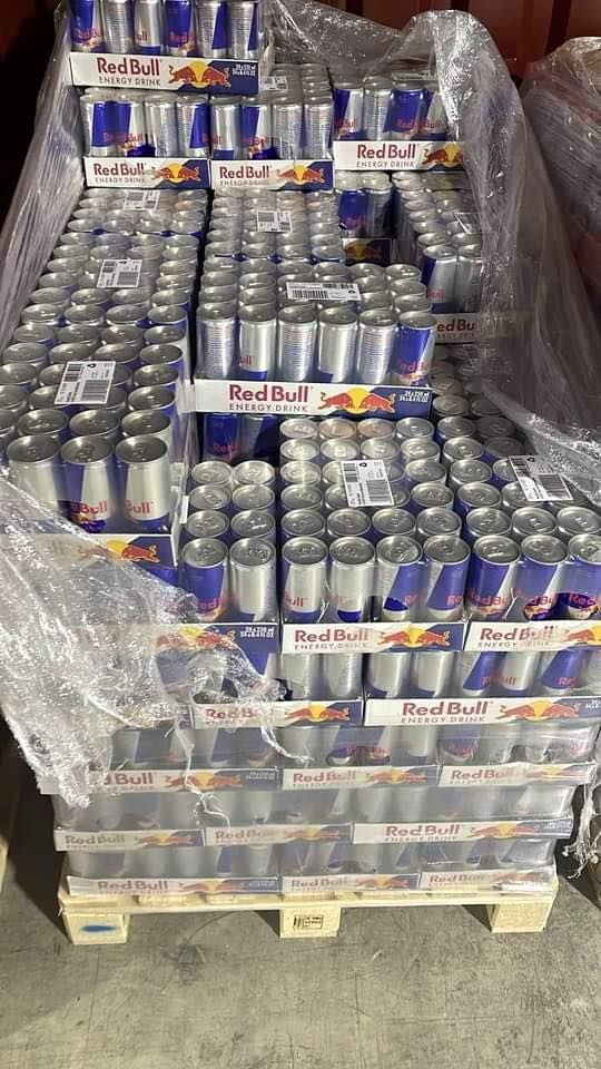 Pallet of Red Bull energy drinks, wrapped in plastic.