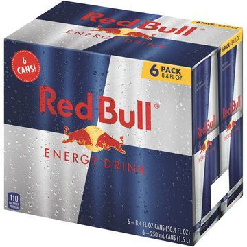 Six-pack of Red Bull energy drink cans. Blue and silver packaging with the Red Bull logo and text.