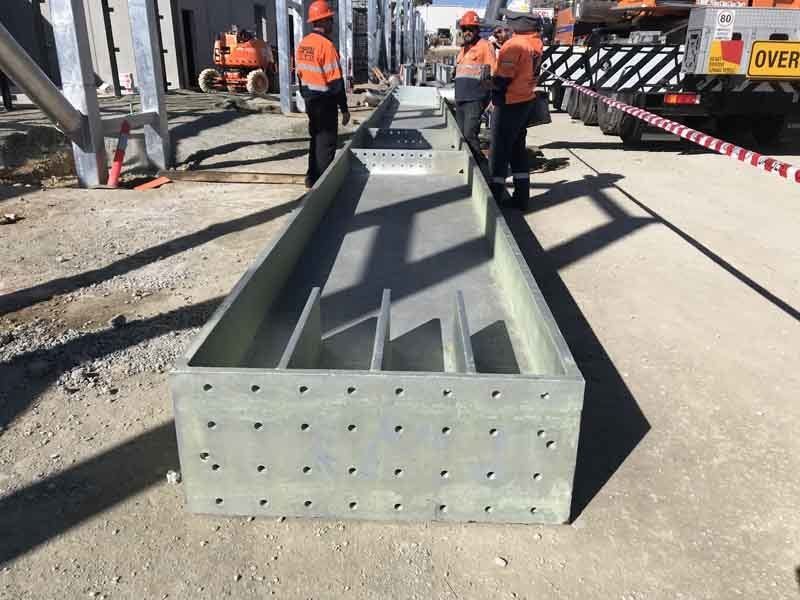 A Group Of Men Standing Next To Each Other On A Road | Canberra ACT | Baxter Engineering