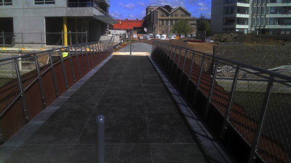 A Walkway With A Fence And A Building In The Background | Canberra ACT | Baxter Engineering