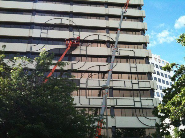 A Tall Building With A Crane In Front Of It | Canberra ACT | Baxter Engineering