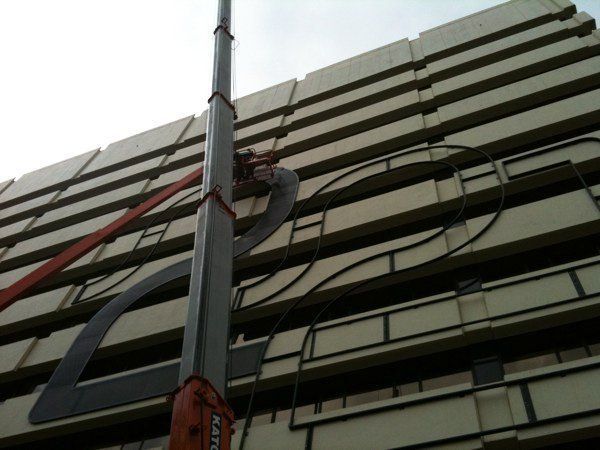 A Tall Building With A Street Light Attached To It | Canberra ACT | Baxter Engineering