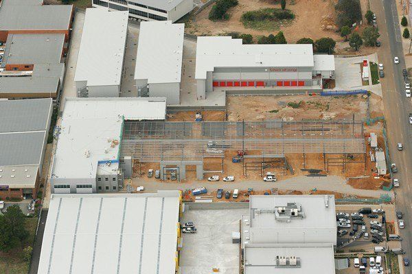 An Aerial View Of A Building With A Lot Of Cars Parked In Front Of It | Canberra ACT | Baxter Engineering