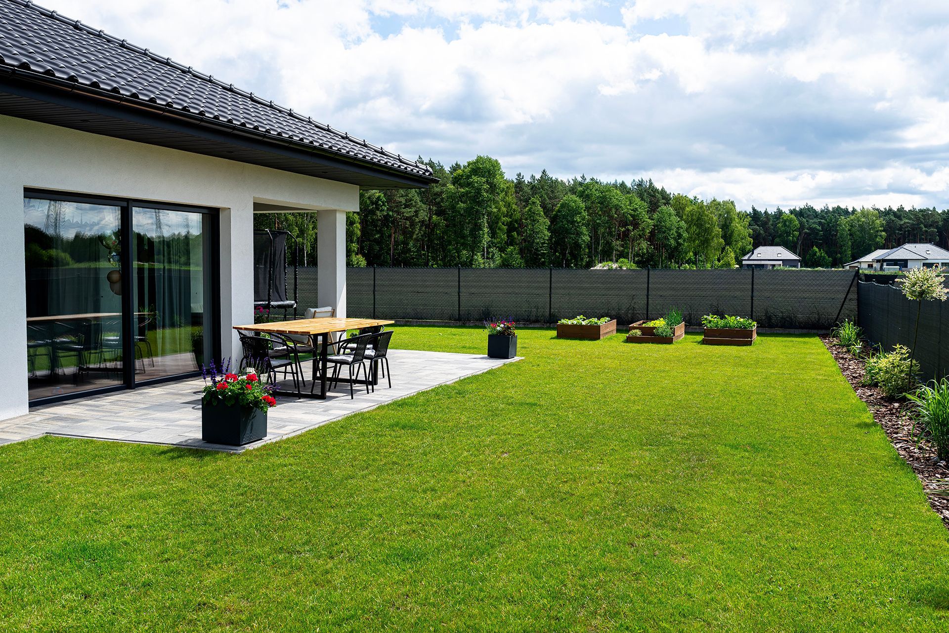 Backyard With Green Lawn