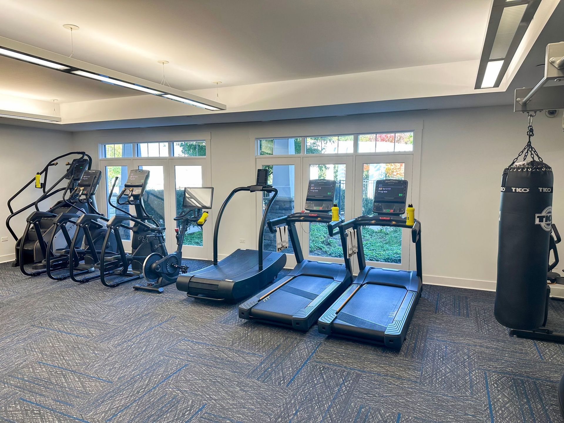 Reserve at Glenview fitness center with machines and windows.