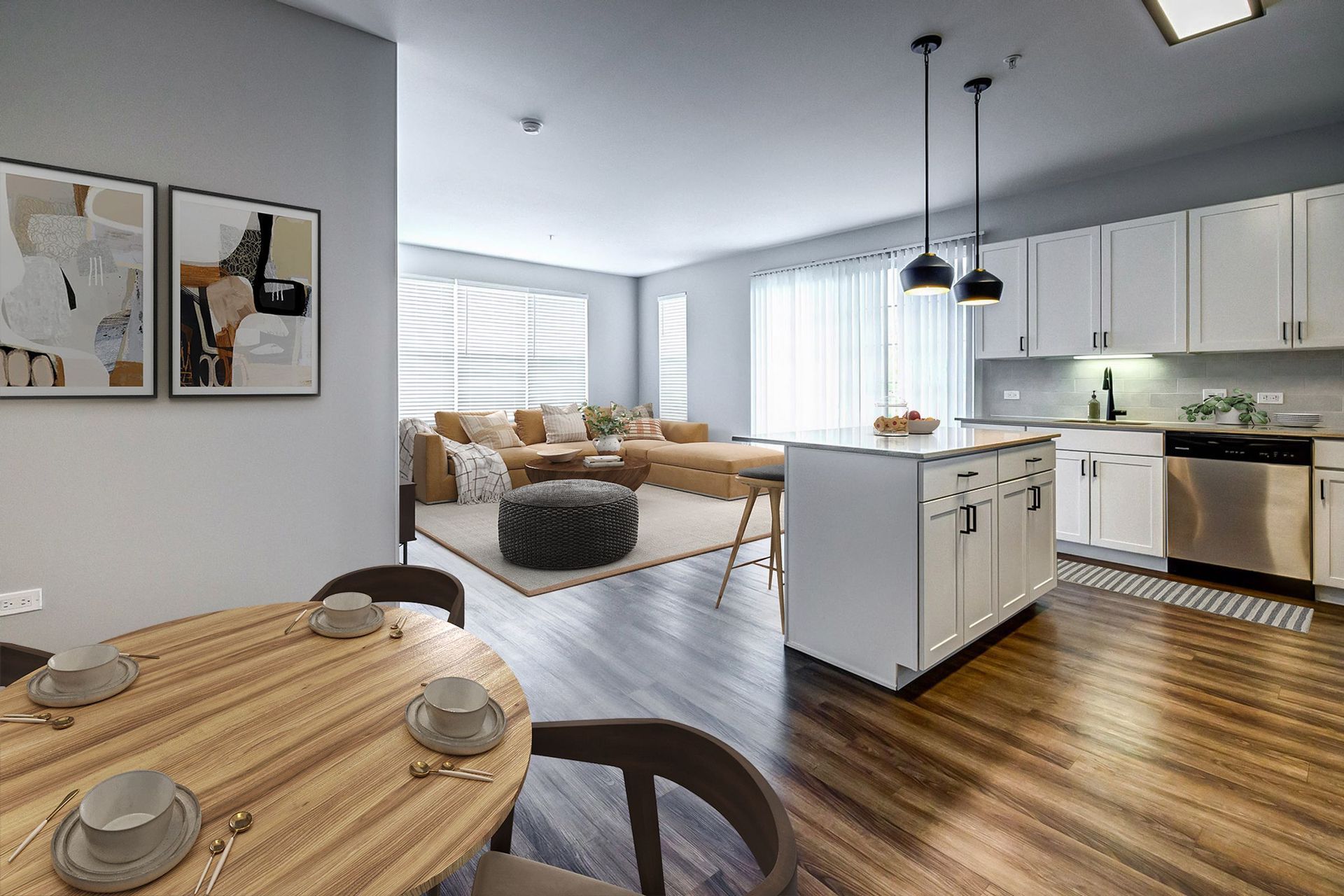A living room with a dining table and chairs and a kitchen.