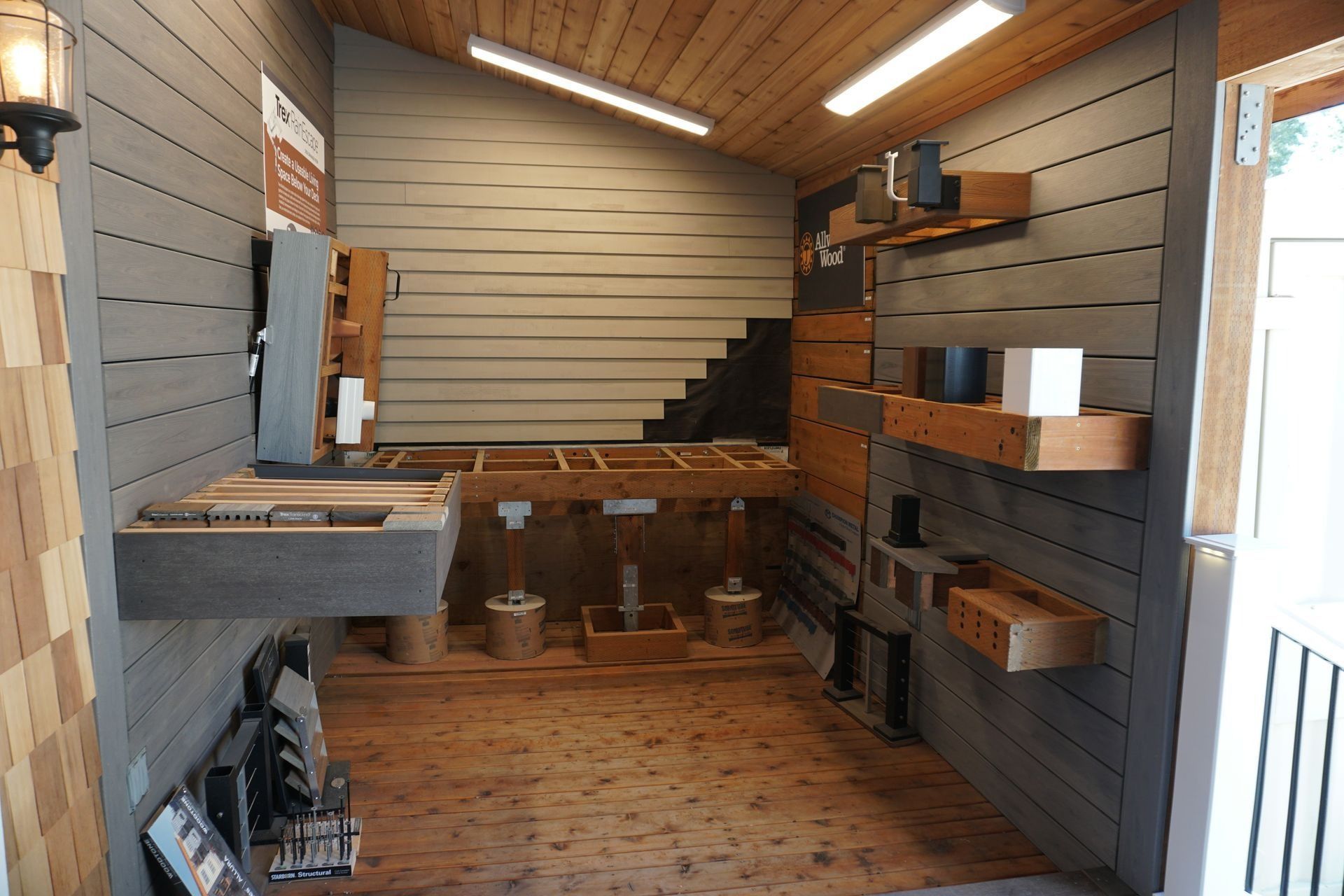 Interior with wooden shelves and a workshop setting.