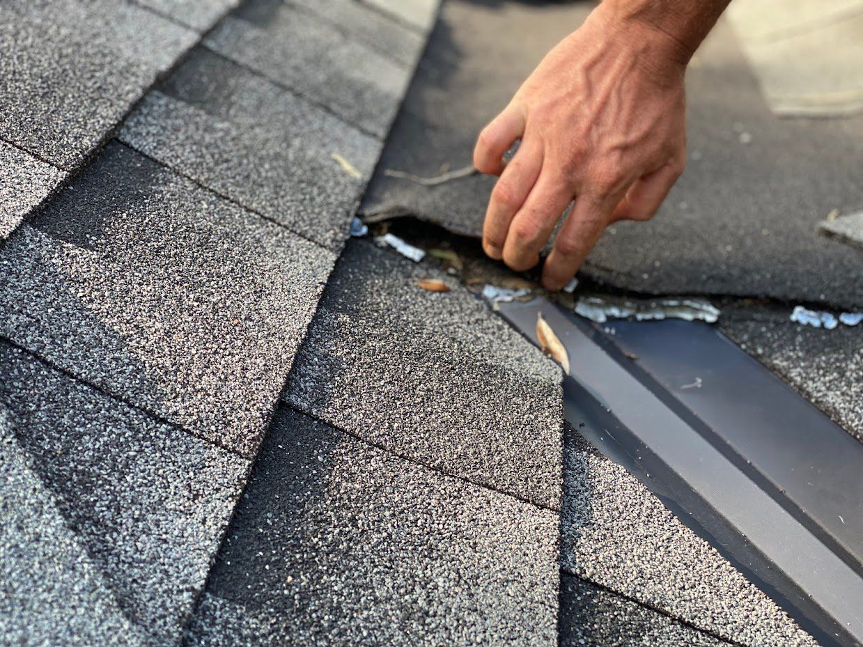 Damaged roof shingles needing repair