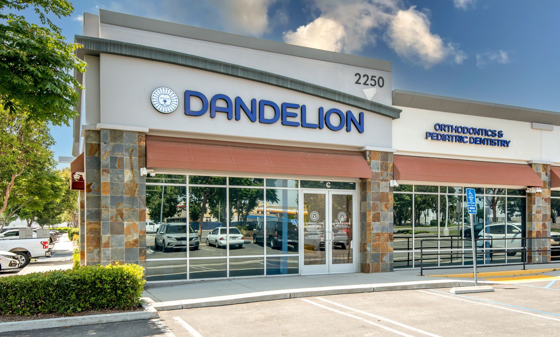 Dandelion storefront with blue signage and tan accents; located at 2250.
