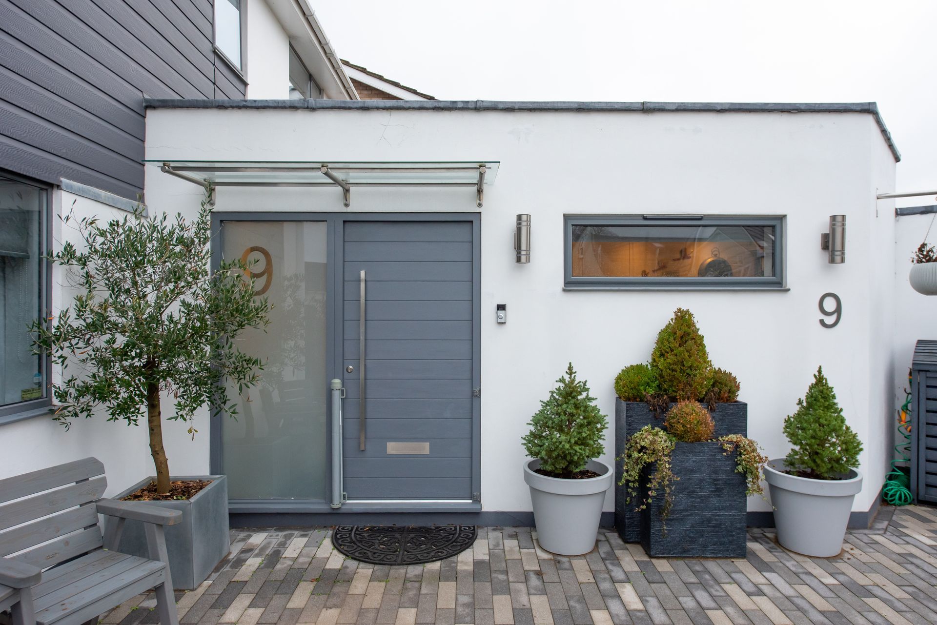 The front door of a house with the number 9 on it