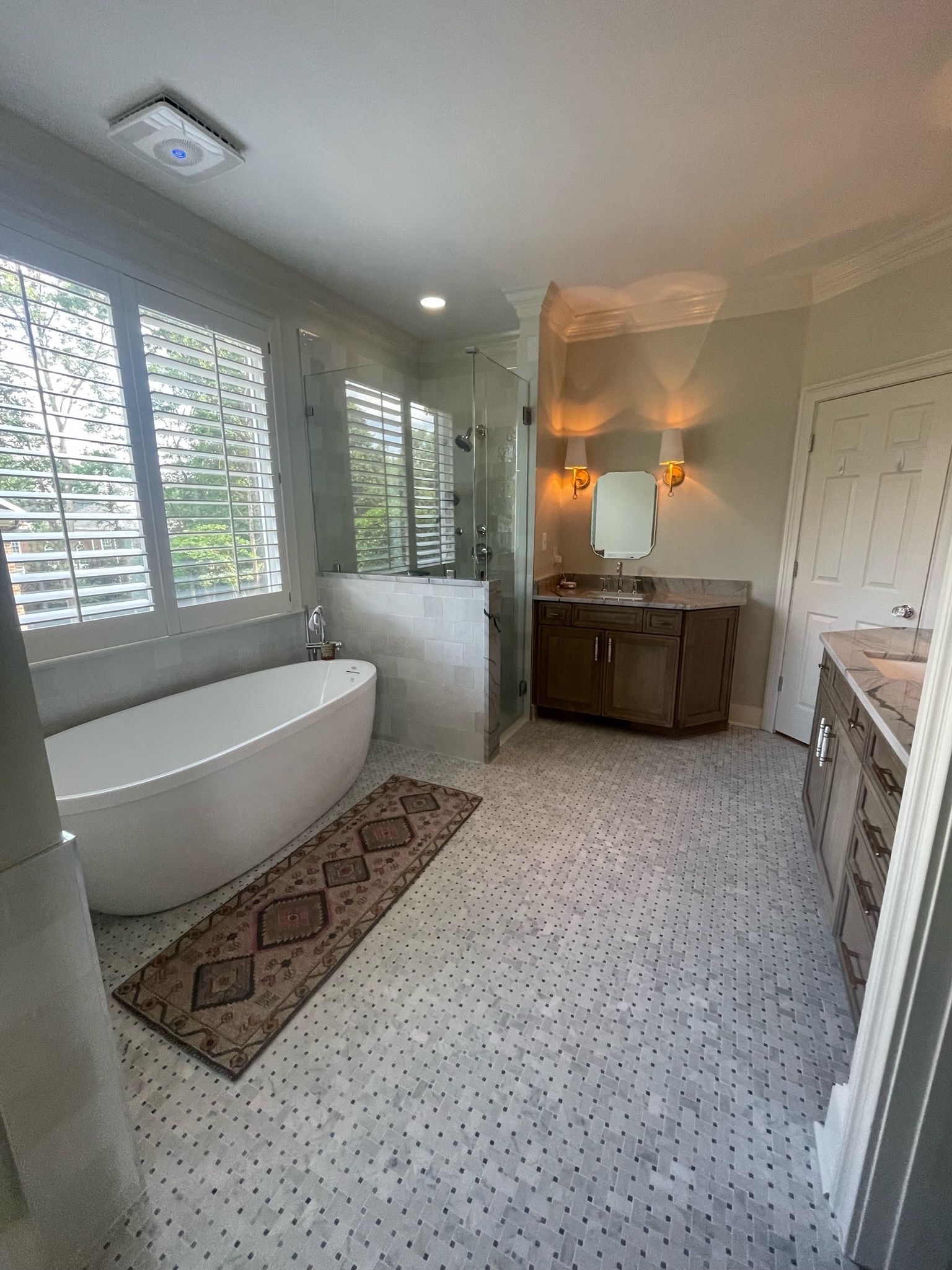 Interior room under construction with drywall on walls and ceiling.