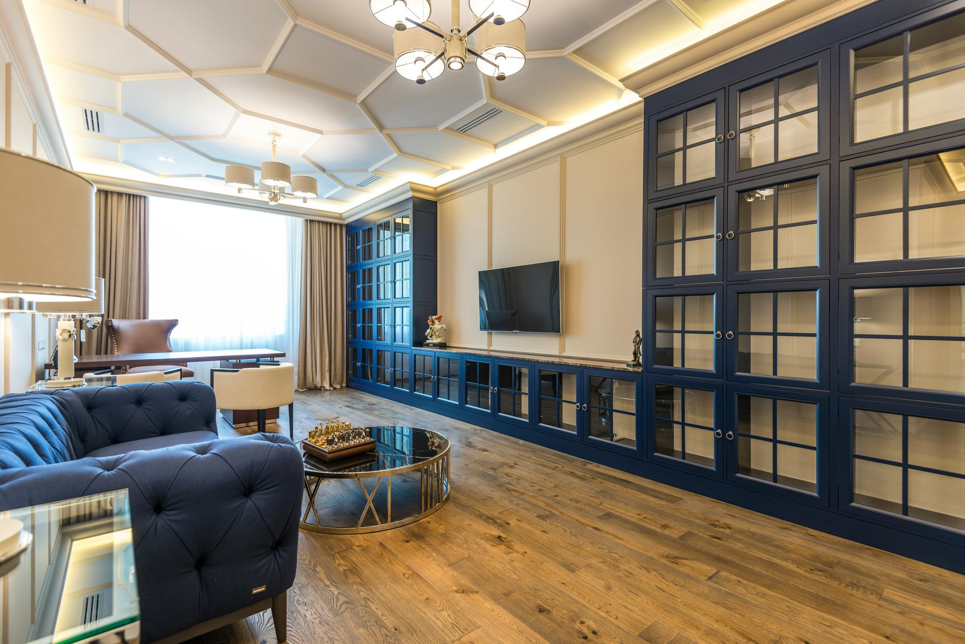 Interior design planning: Paint swatches, countertop samples, and blueprints.