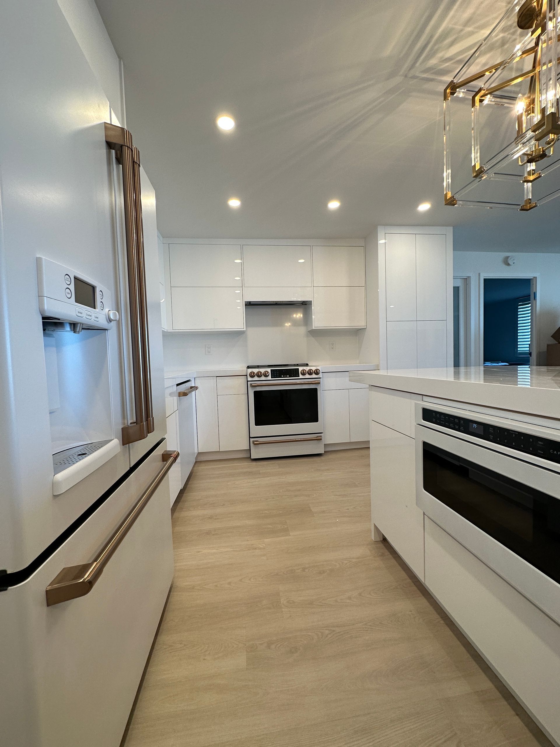 neat white kitchen wood floors