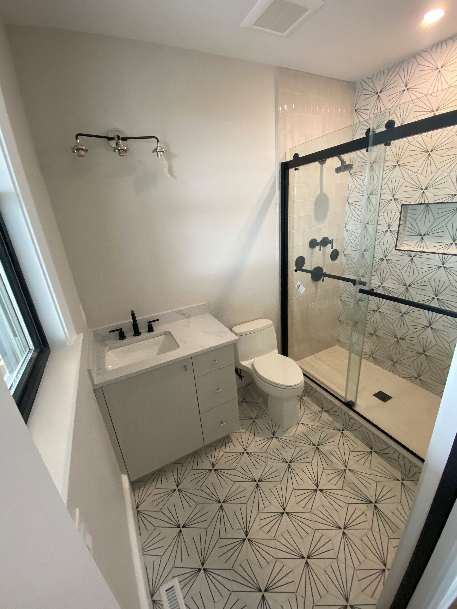 bathroom sink and glass shower