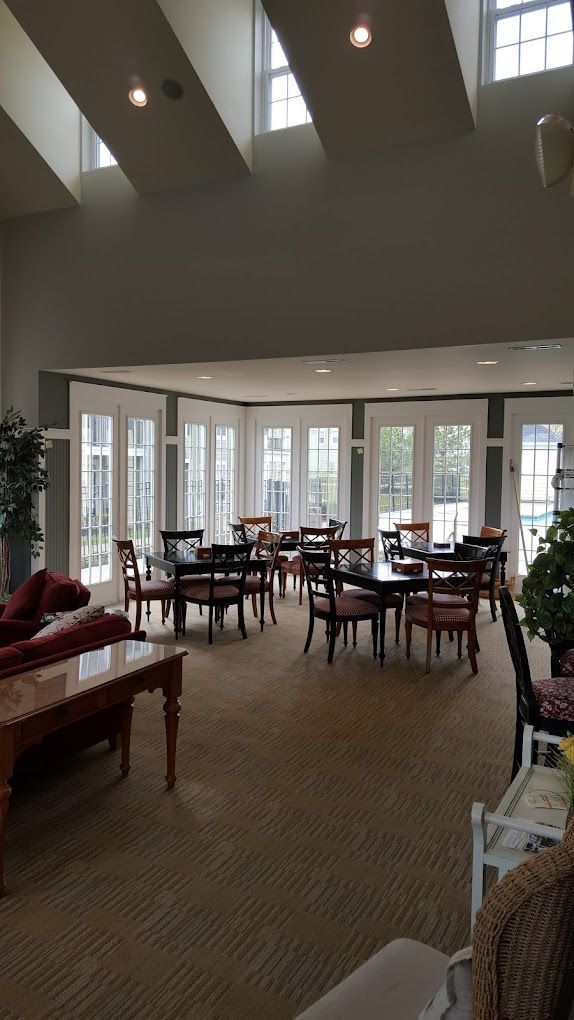 A large room with tables and chairs in it