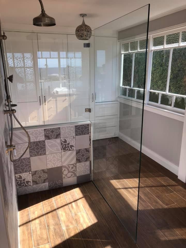 A Bathroom with A Walk in Shower and A Glass Door ā Gads Glass & Shower Screens in Albion Park, NSW