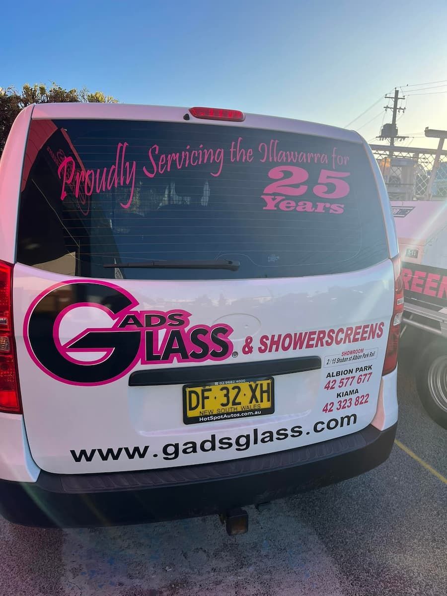 A White Van with A Sticker on The Back Window — Gads Glass & Shower Screens in Albion Park, NSW