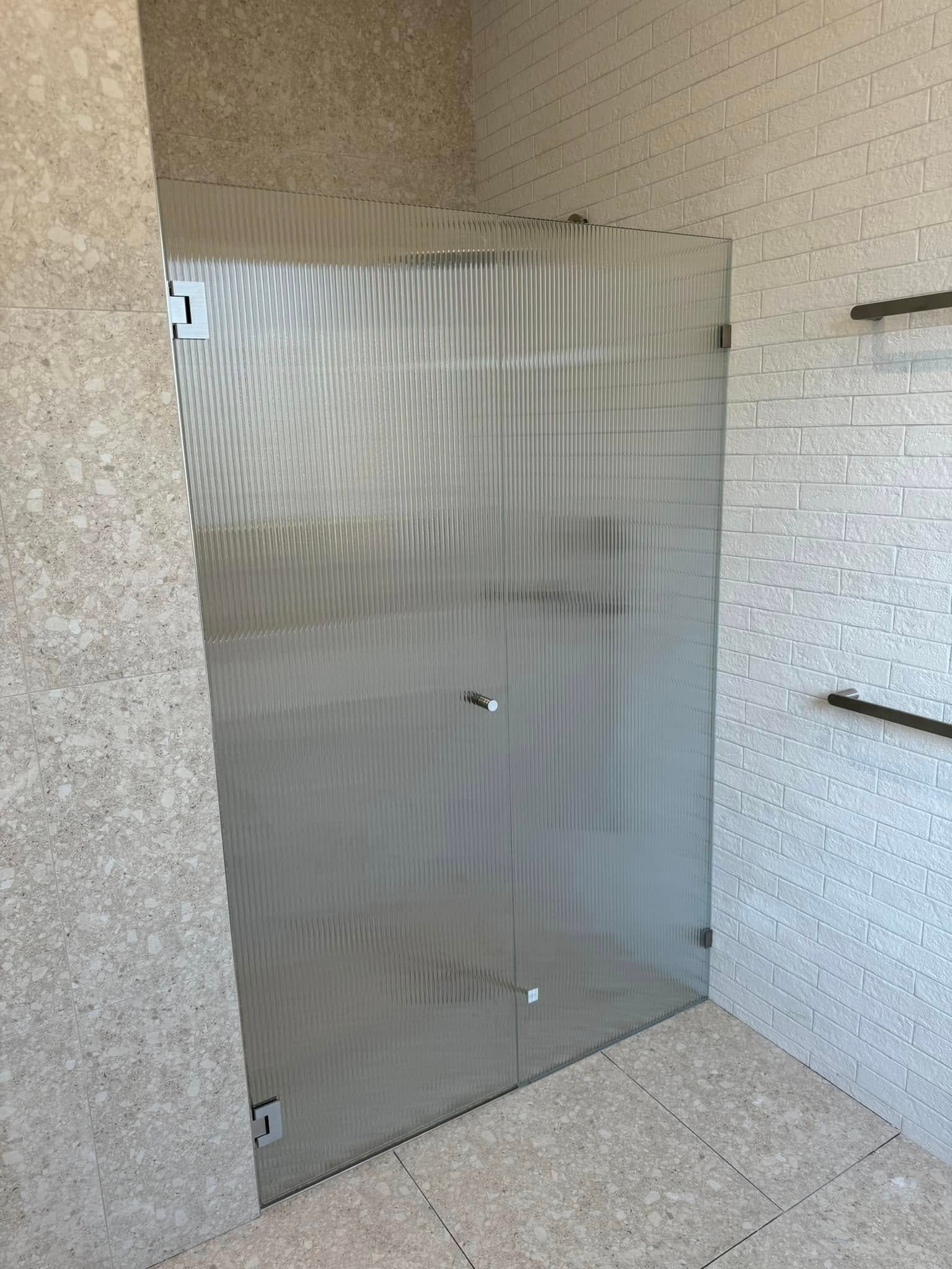 A Hallway with A Sliding Glass Door — Gads Glass & Shower Screens in Albion Park, NSW