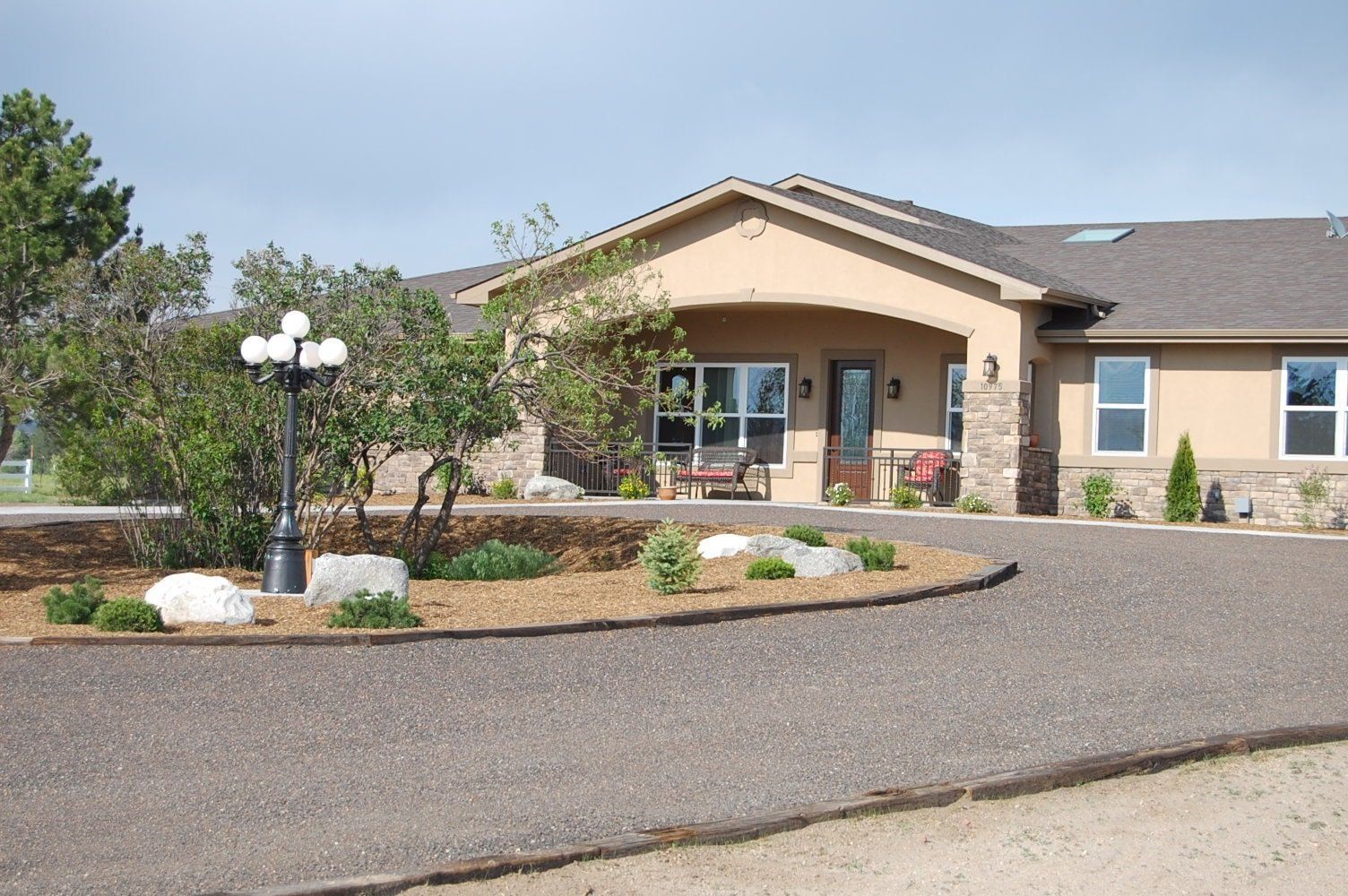 A large house with a driveway leading to it