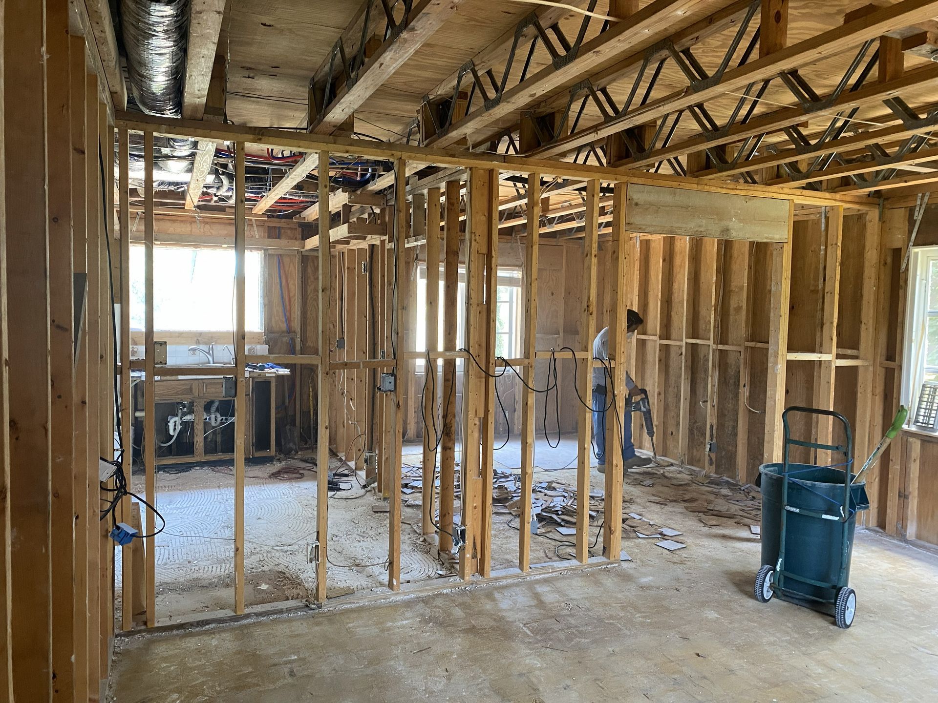 Interior room with exposed wooden studs, undergoing renovation.