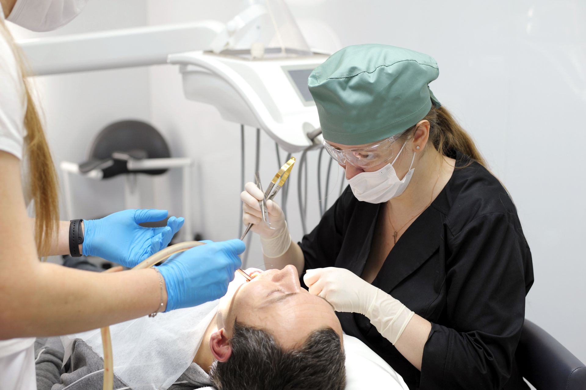 A woman is having her teeth cleaned at Praire Point Dental in Aurora, IL, emphasizing their commitme