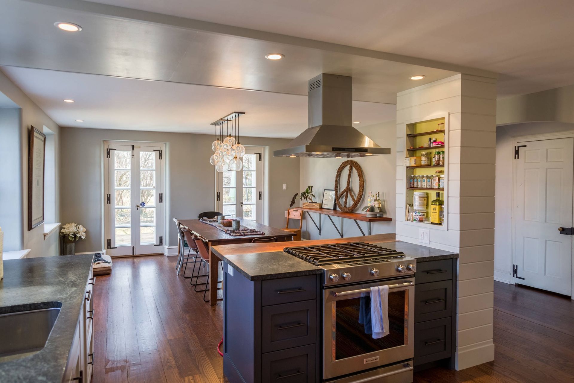 A kitchen with a stove , oven , sink and a peace sign on the wall. James McCoy Remodeling Services Serving 19072,19003,19118,19444,19095 and surrounding areas