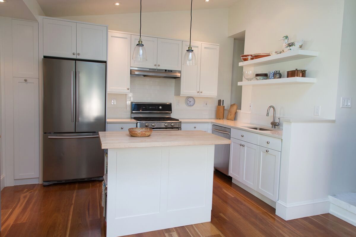 A kitchen with white cabinets and stainless steel appliances James McCoy Remodeling Services Serving 19072,19003,19118,19444,19095 and surrounding areas