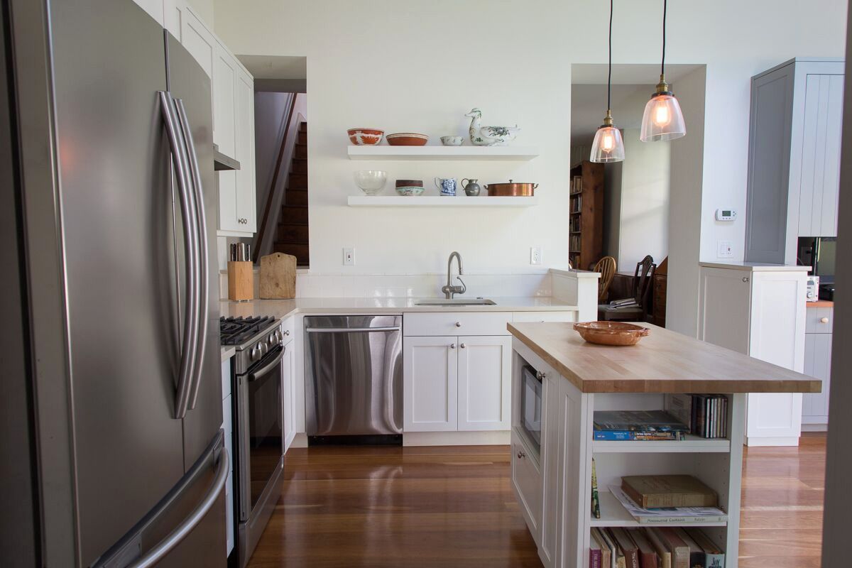 A kitchen with stainless steel appliances and white cabinets.  James McCoy Remodeling Services Serving 19072,19003,19118,19444,19095 and surrounding areas