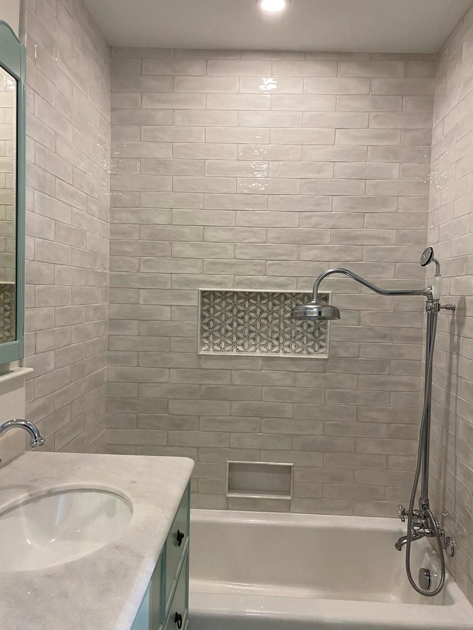 A bathroom with a sink , tub , shower and mirror. James McCoy Remodeling Services Serving 19072,19003,19118,19444,19095 and surrounding areas