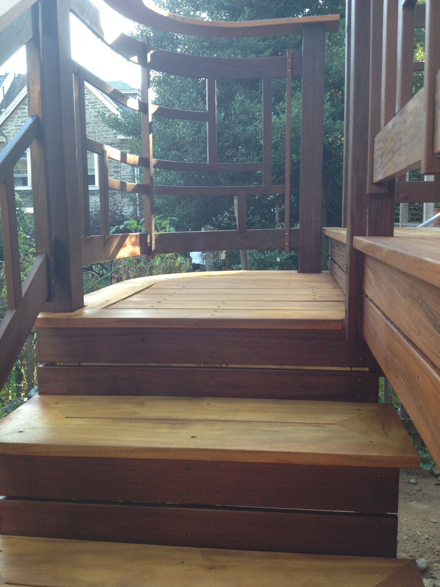 A wooden deck with stairs and a gate. James McCoy Remodeling Services Serving 19072,19003,19118,19444,19095 and surrounding areas