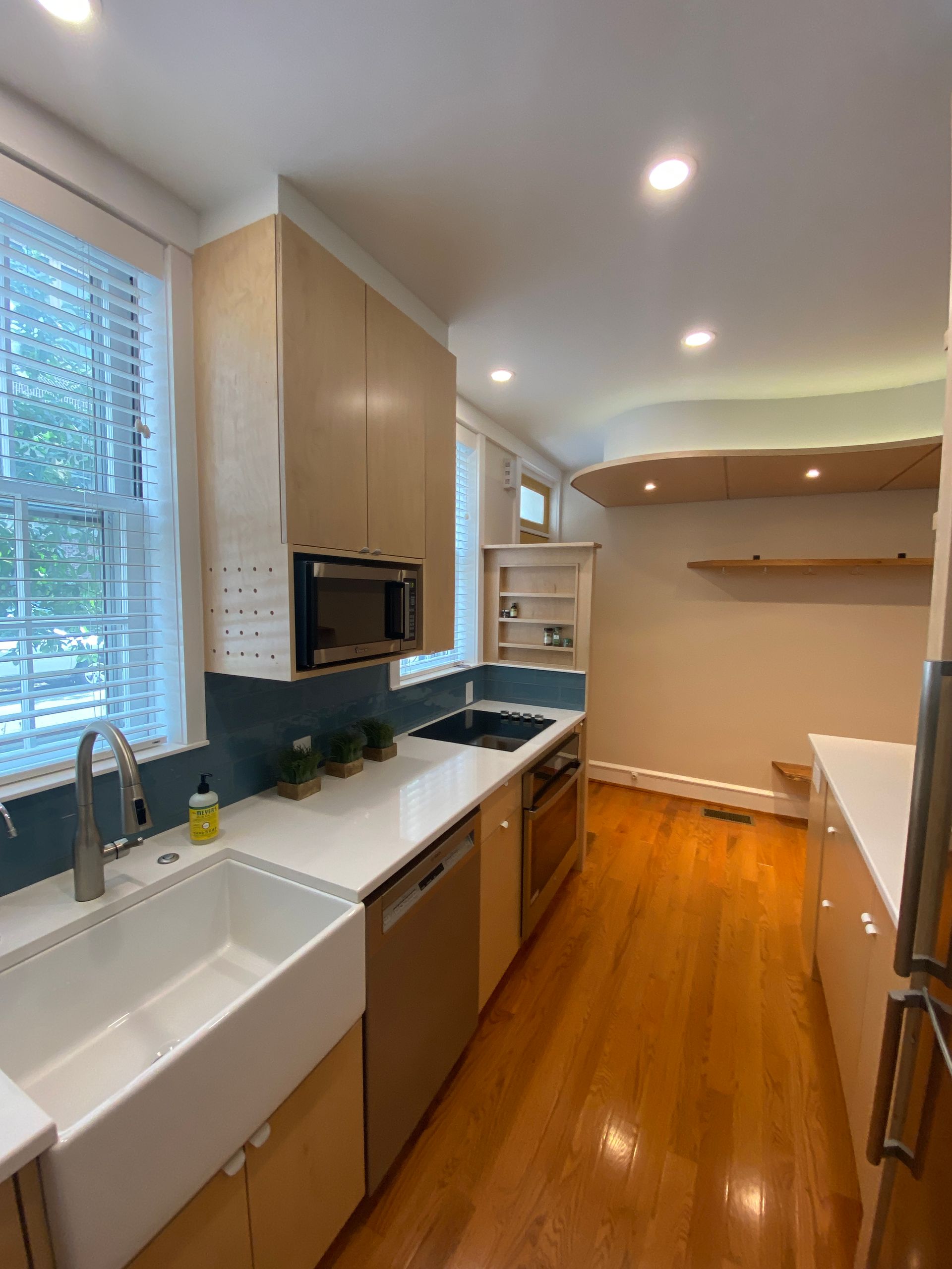 A kitchen with a sink , stove , dishwasher and microwave. James McCoy Remodeling Services Serving 19072,19003,19118,19444,19095 and surrounding areas